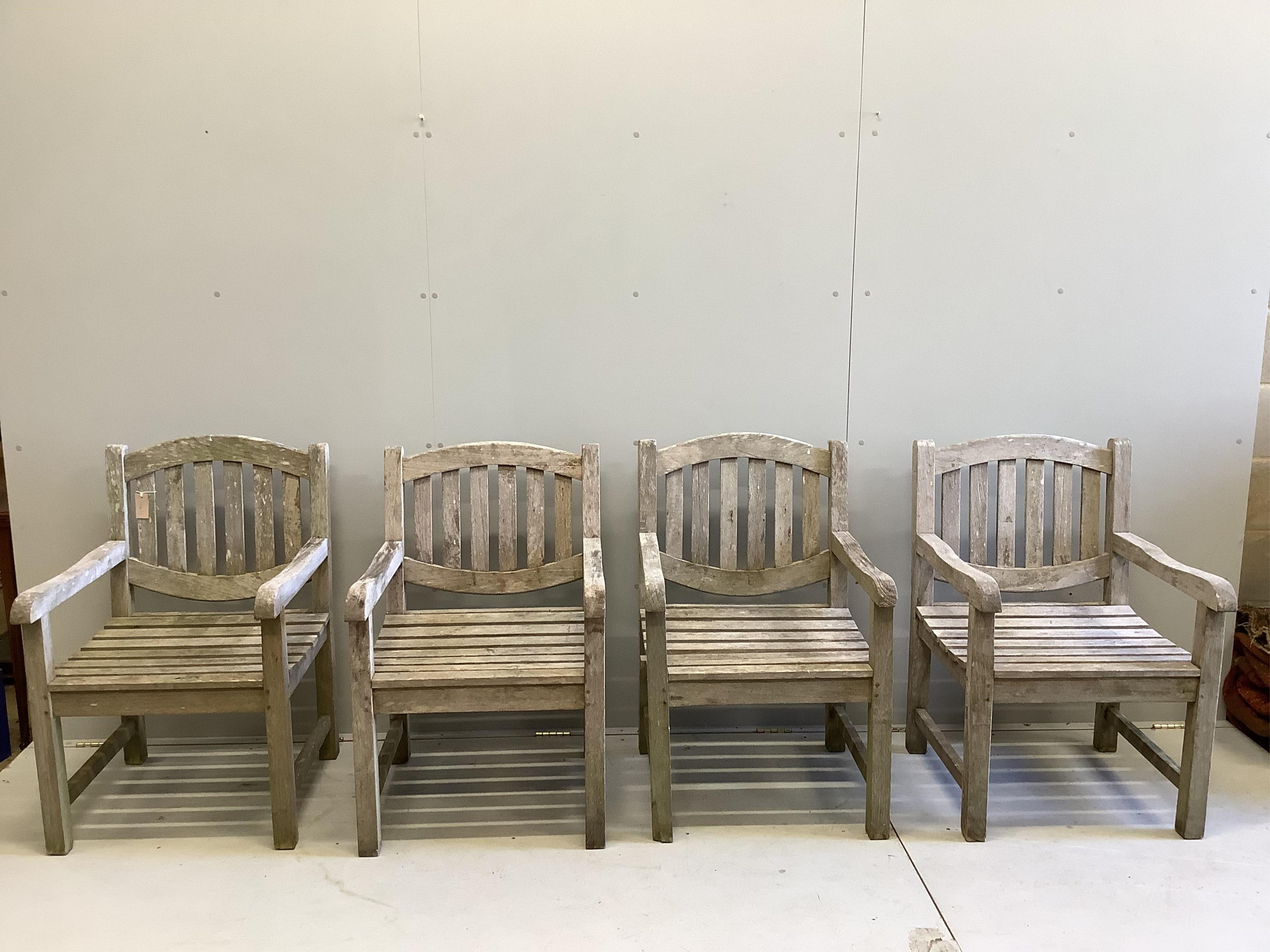 A set of four weathered teak garden chairs and a square top table, width 90cm. Condition - fair